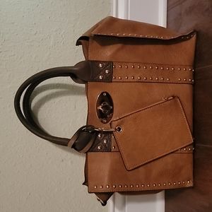 Brown leather purse with gold accents.